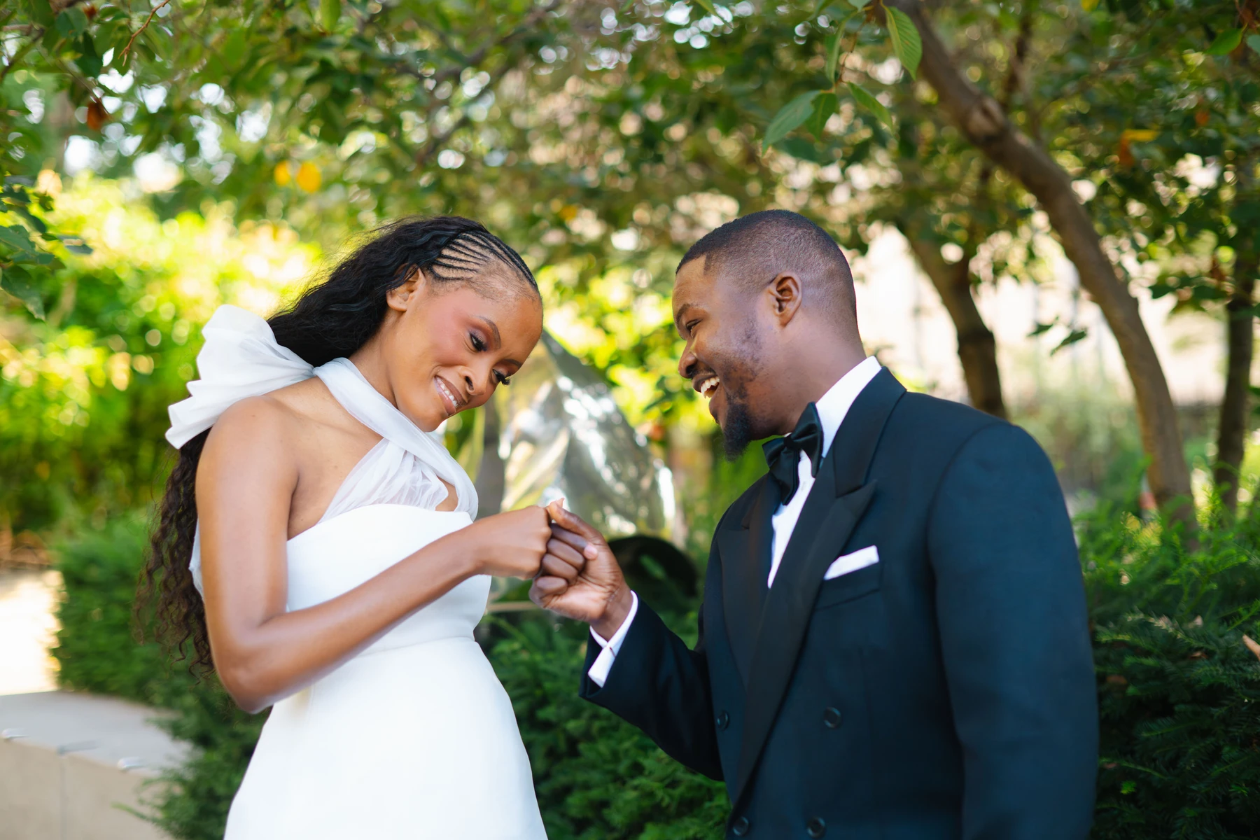 Kennedy and Didimalang sharing a playful fist bump during their engagement photoshoot